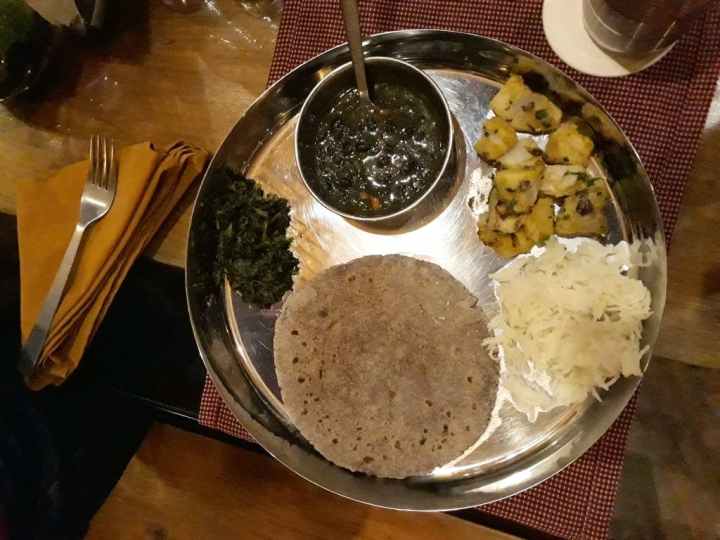 enjoy local cuisine, Kumaoni thali, at Corbett Wild Iris resort & Spa, Jim Corbett National Park, Uttarakhand, India